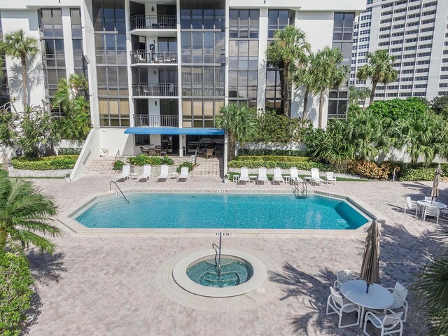 view of swimming pool with a patio area