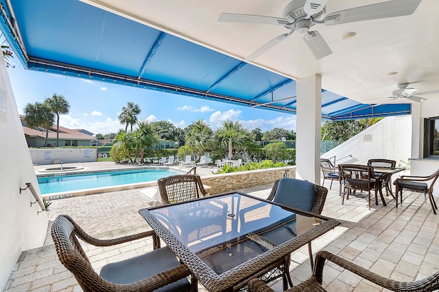 view of swimming pool with a patio and ceiling fan