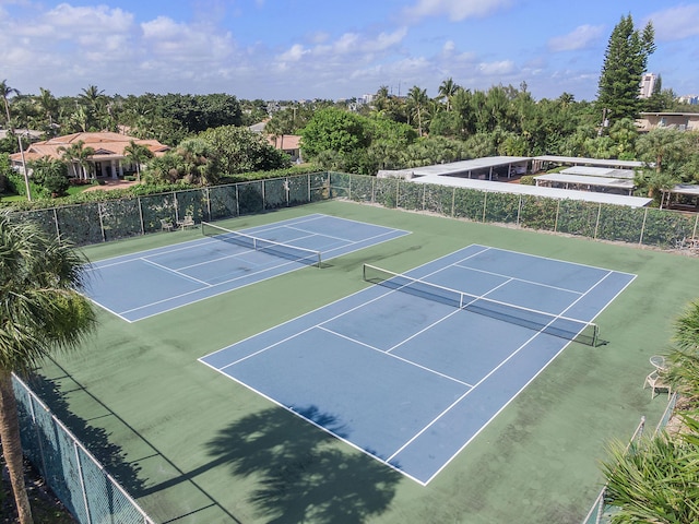 view of sport court featuring fence