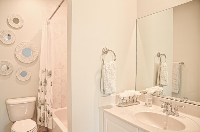 full bathroom with vanity, toilet, and shower / tub combo