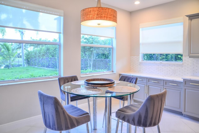 dining room featuring light tile patterned flooring