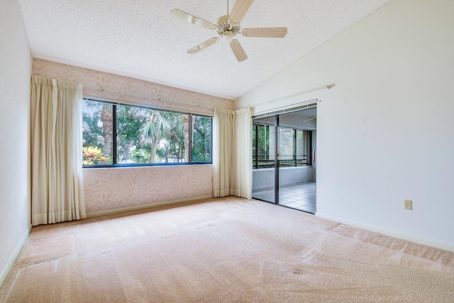 interior space with a textured ceiling, ceiling fan, and vaulted ceiling