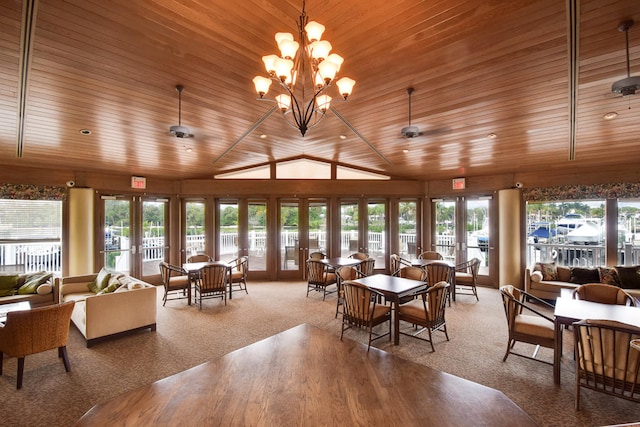 dining area featuring a chandelier, french doors, wood ceiling, and a wealth of natural light