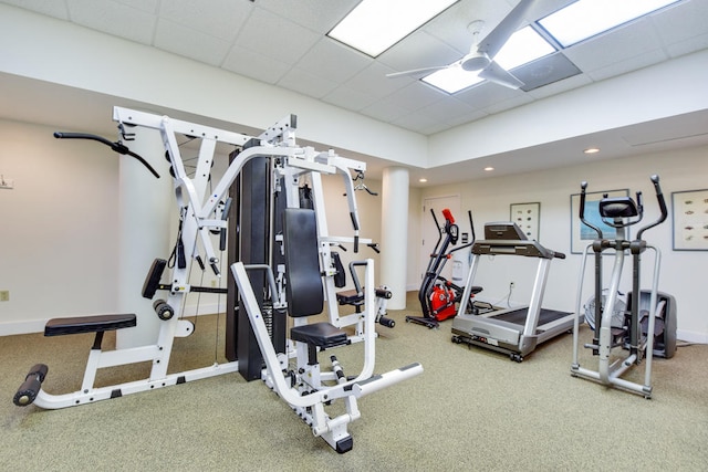 gym featuring carpet floors and a drop ceiling