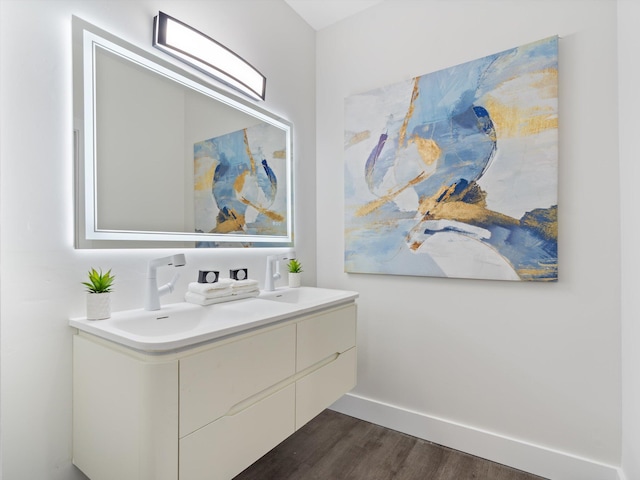 bathroom with vanity and hardwood / wood-style flooring