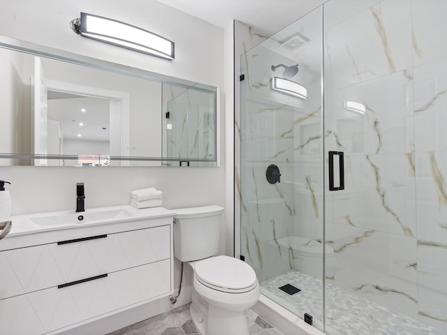 bathroom with vanity, walk in shower, toilet, and tile patterned floors