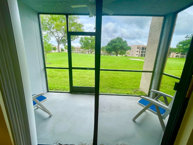 sunroom / solarium with ceiling fan