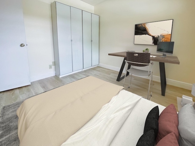 bedroom featuring light wood-type flooring and a closet