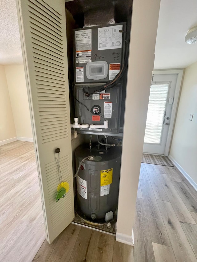 utility room featuring water heater