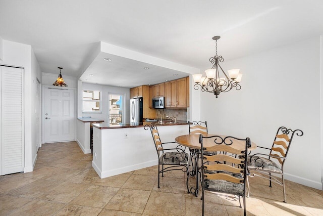 dining space with a chandelier