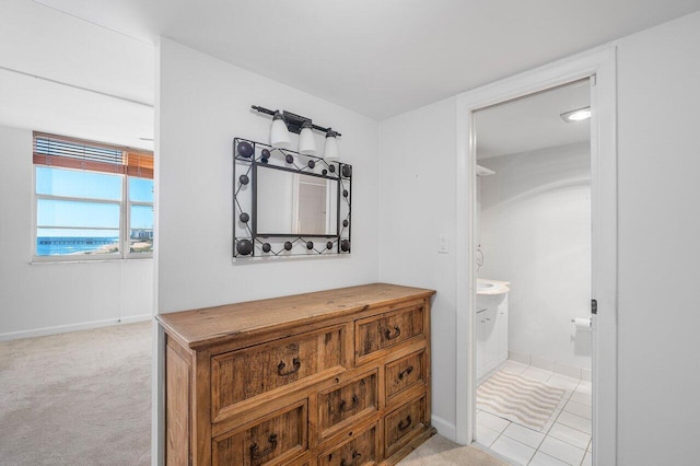 bathroom featuring tile patterned flooring and vanity