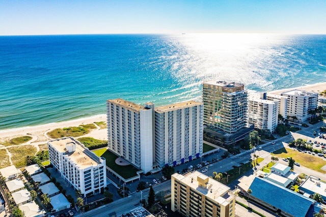 bird's eye view featuring a water view and a view of the beach