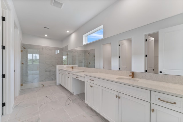 bathroom with dual vanity, an enclosed shower, and tile patterned flooring