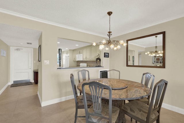 tiled dining room featuring crown molding, a textured ceiling, and a notable chandelier