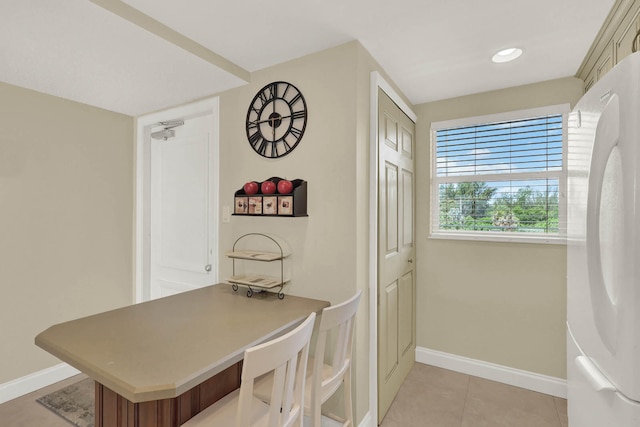 dining room with light tile patterned floors