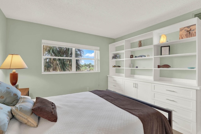 bedroom featuring a textured ceiling