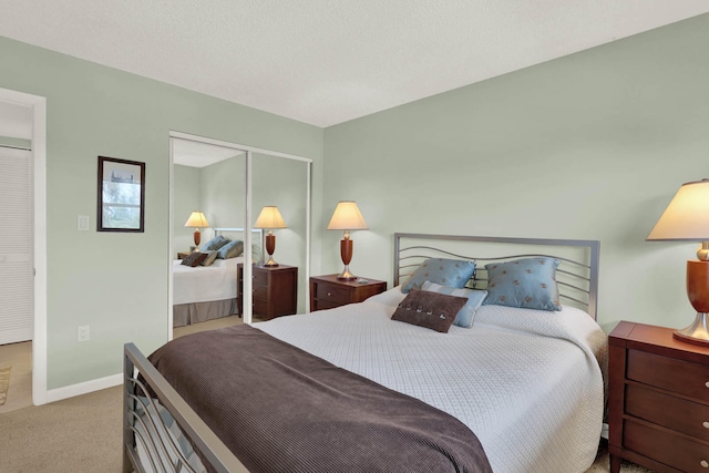 bedroom with light carpet and a closet