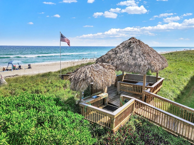 property view of water with a gazebo and a beach view