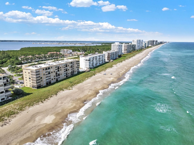 bird's eye view featuring a beach view and a water view