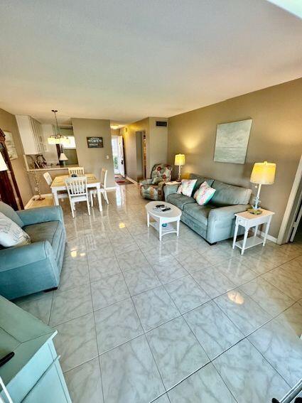 living room with light tile patterned floors