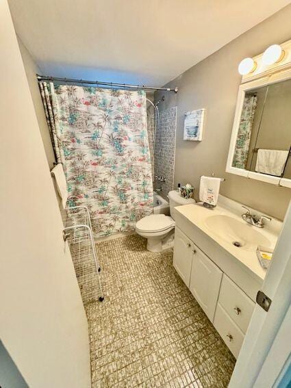 full bathroom with shower / tub combo, toilet, tile patterned flooring, and vanity