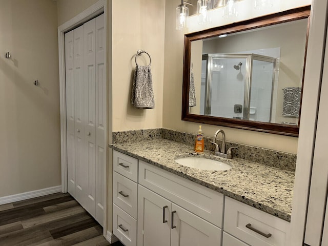 bathroom featuring vanity and hardwood / wood-style floors