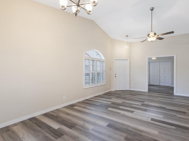 6166 Lake Hibiscus Dr, Delray Beach, FL 33484 - empty room with a chandelier, high vaulted ceiling, baseboards, wood finished floors, and a ceiling fan