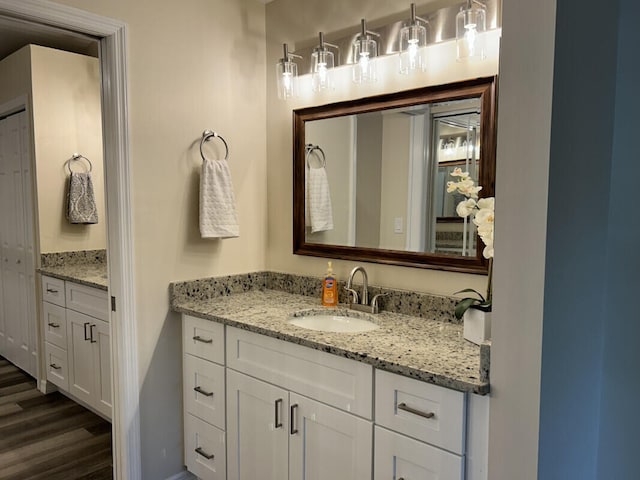 bathroom with vanity and wood-type flooring