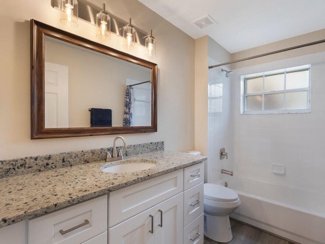 6166 Lake Hibiscus Dr, Delray Beach, FL 33484 - bathroom with vanity, toilet, shower / tub combo, and wood finished floors
