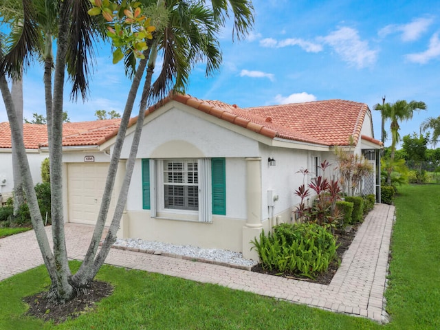 6166 Lake Hibiscus Dr, Delray Beach, FL 33484 - view of side of home featuring stucco siding, an attached garage, a tiled roof, and a lawn