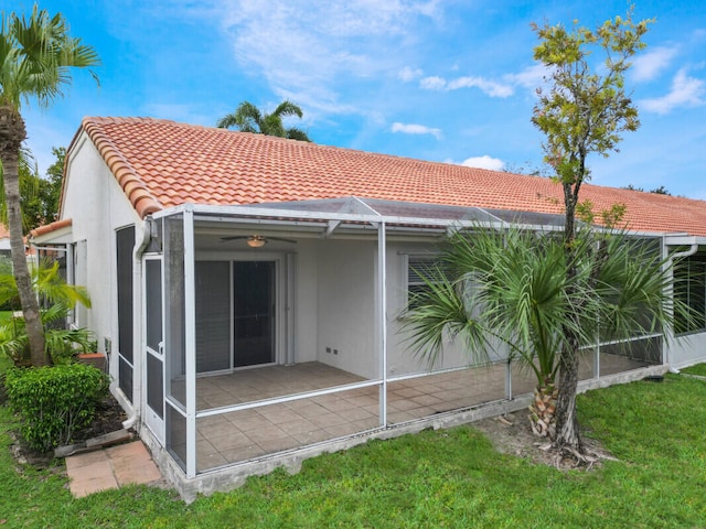 6166 Lake Hibiscus Dr, Delray Beach, FL 33484 - rear view of house featuring a tile roof, stucco siding, and a patio area