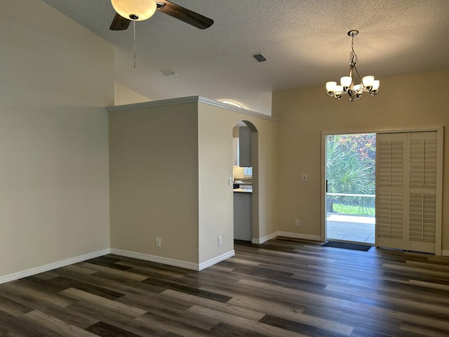 unfurnished room with dark wood-type flooring, ceiling fan with notable chandelier, and a textured ceiling