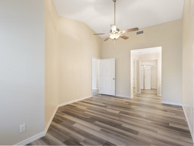 6166 Lake Hibiscus Dr, Delray Beach, FL 33484 - empty room featuring high vaulted ceiling, a ceiling fan, baseboards, and wood finished floors