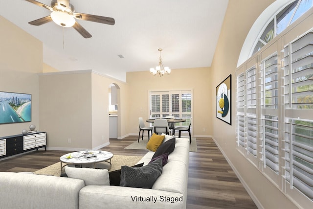 6166 Lake Hibiscus Dr, Delray Beach, FL 33484 - living area with arched walkways, a chandelier, wood finished floors, high vaulted ceiling, and baseboards