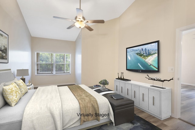 6166 Lake Hibiscus Dr, Delray Beach, FL 33484 - bedroom with light wood finished floors, vaulted ceiling, and ceiling fan