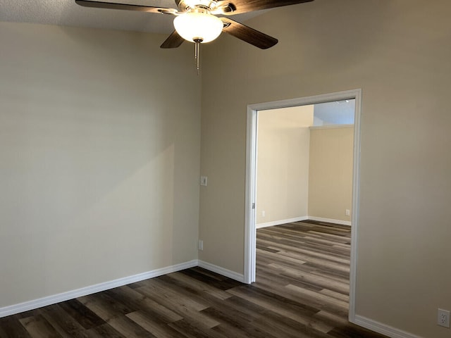 spare room featuring dark hardwood / wood-style flooring, a textured ceiling, and ceiling fan