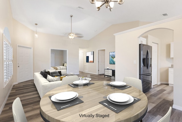 6166 Lake Hibiscus Dr, Delray Beach, FL 33484 - dining area with wood finished floors, arched walkways, baseboards, lofted ceiling, and a chandelier