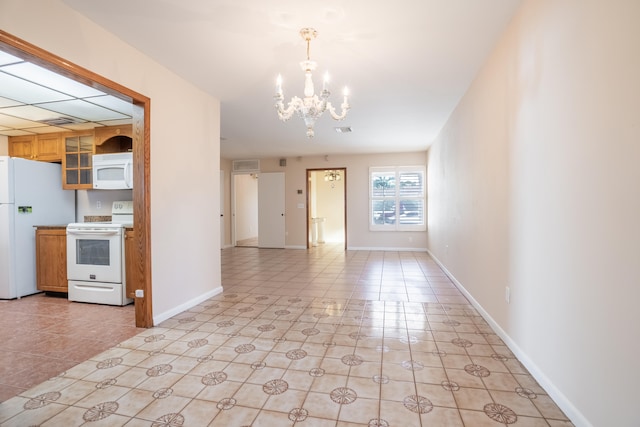 interior space with light tile patterned floors and an inviting chandelier