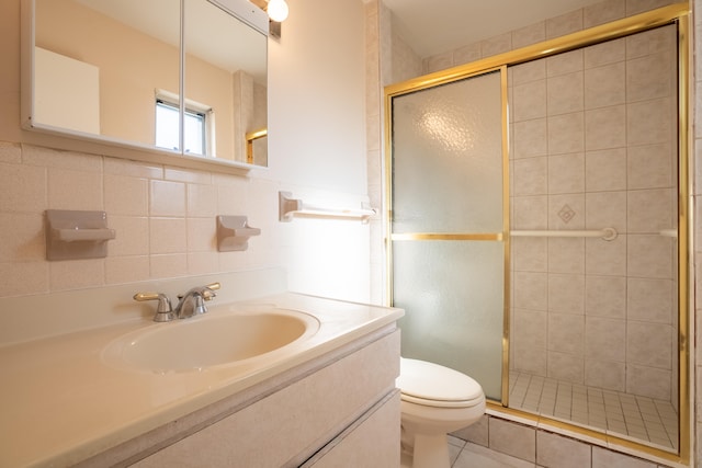 bathroom with vanity, toilet, walk in shower, and decorative backsplash