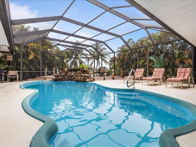 view of pool with a lanai and a patio area