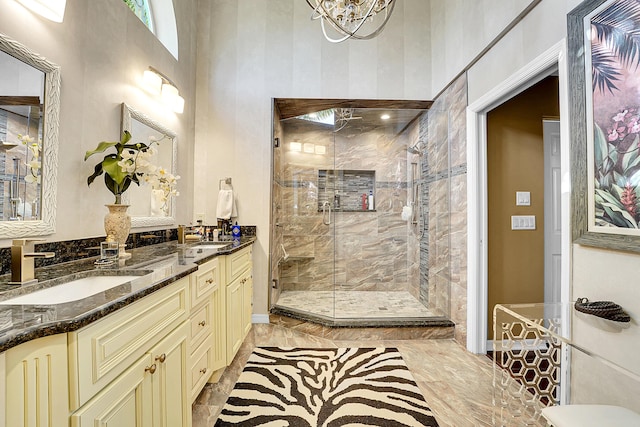 bathroom with vanity and a shower with shower door