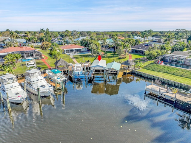 birds eye view of property with a water view