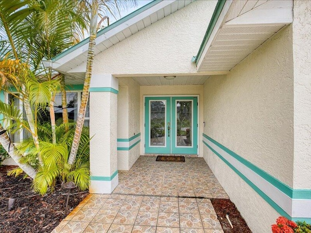 property entrance featuring french doors