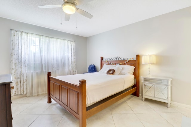 bedroom with light tile patterned floors and ceiling fan