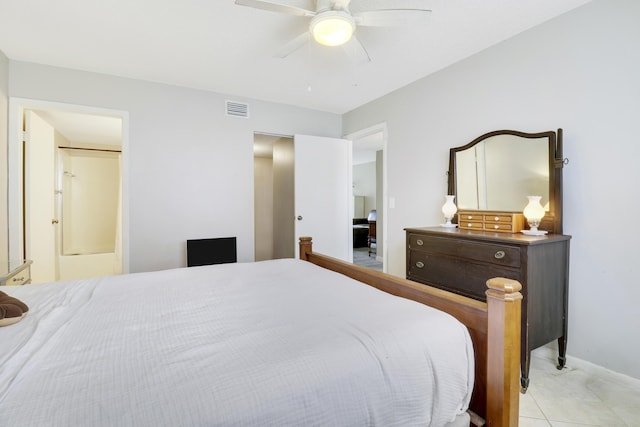 bedroom with ensuite bath and ceiling fan