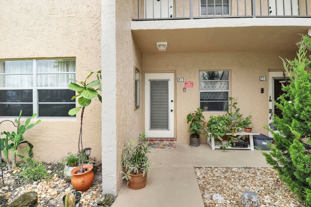 property entrance with a balcony