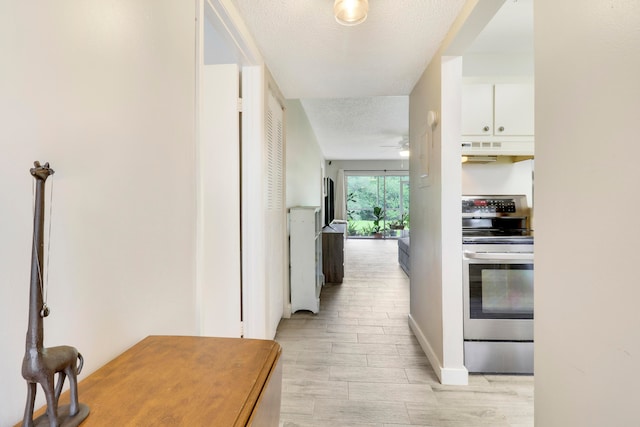 hallway featuring a textured ceiling