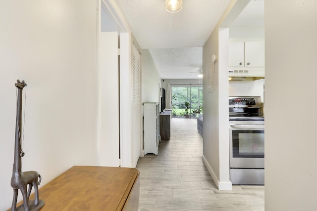 hallway featuring a textured ceiling