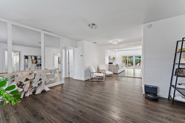 living room with dark hardwood / wood-style flooring