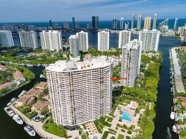 birds eye view of property featuring a water view and a view of city